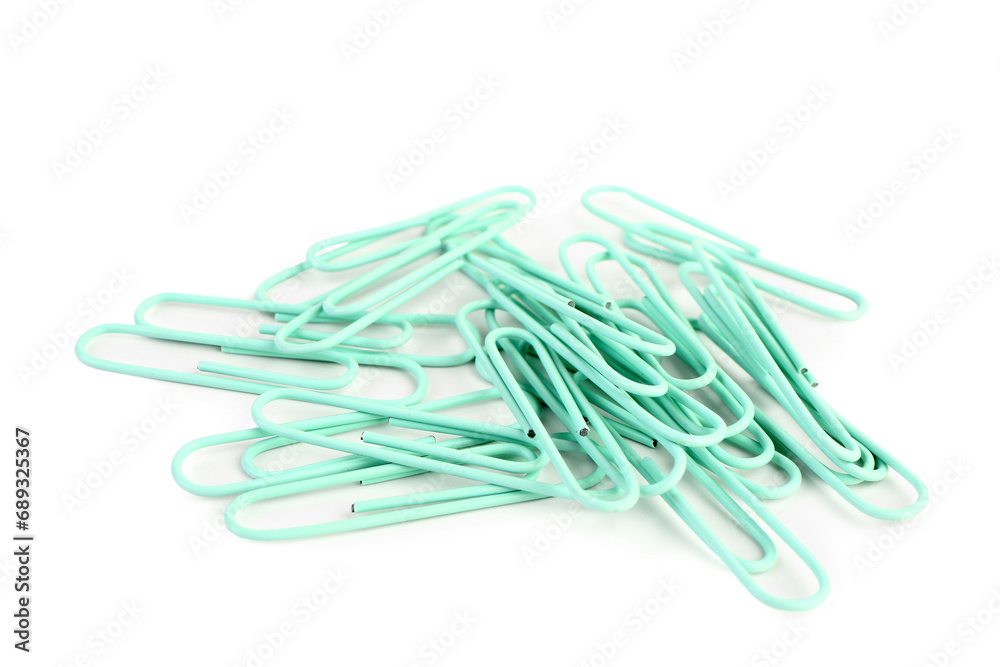 Heap of green paper clips on white background Heap of green paper clips on white background