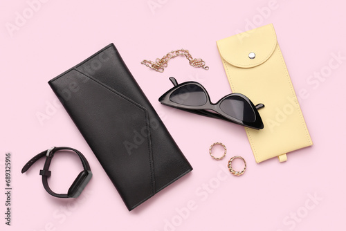 Composition with stylish sunglasses, modern smartwatch, jewelry and case on pink background