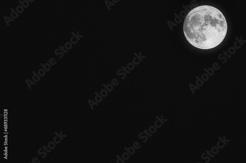 Full moon close up photo. Close up of full Luna. Detail of moon surface. Isolated background. Full moon closeup showing the details of the lunar surface. The Moon isolated on a black. Explorer space