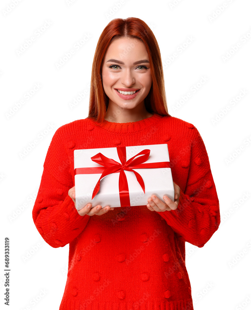 Fototapeta premium Young woman in red sweater with gift box on white background. Christmas celebration