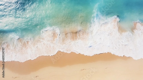 Turquoise waves flowing on the sandy coast, holiday background
