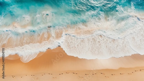 Turquoise waves flowing on the sandy coast, holiday background