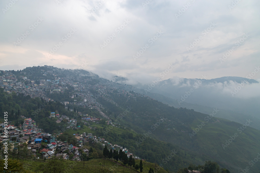 Town on a mountainside in darjeeling, west bengal, India. Stunning views of hills on sunrise.