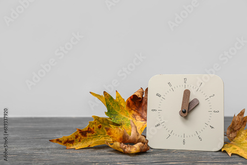 Alarm clock and autumn leav...