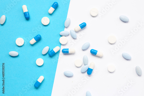 Many different pills on colorful background