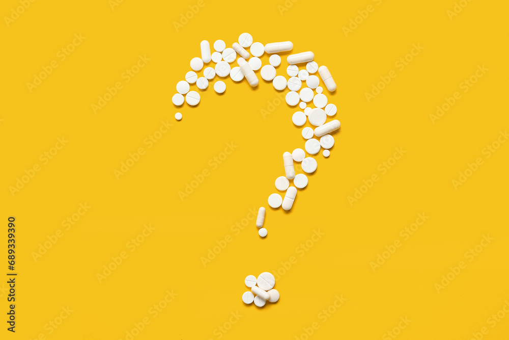 Question mark made of white pills on yellow background - obrazy, fototapety, plakaty 