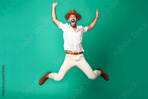 Dynamics of joy, A joyful man in motion on a green background a vibrant stock photo capturing the energetic and uplifting spirit of pure happiness.