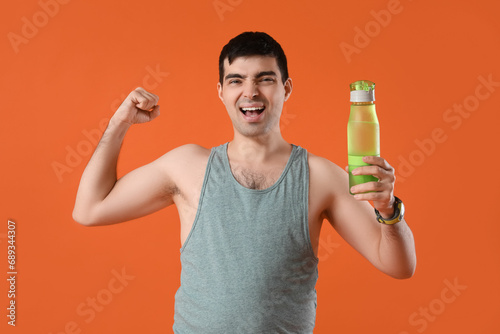 Sporty young man with water...