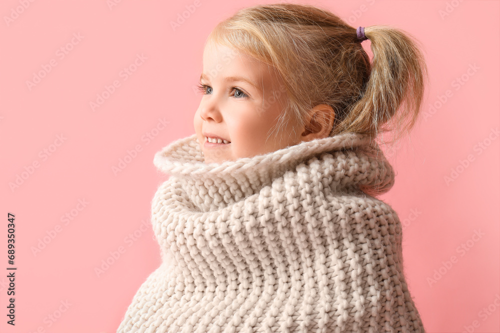Cute little girl in knitted scarf on pink background Cute little girl in knitted scarf on pink background