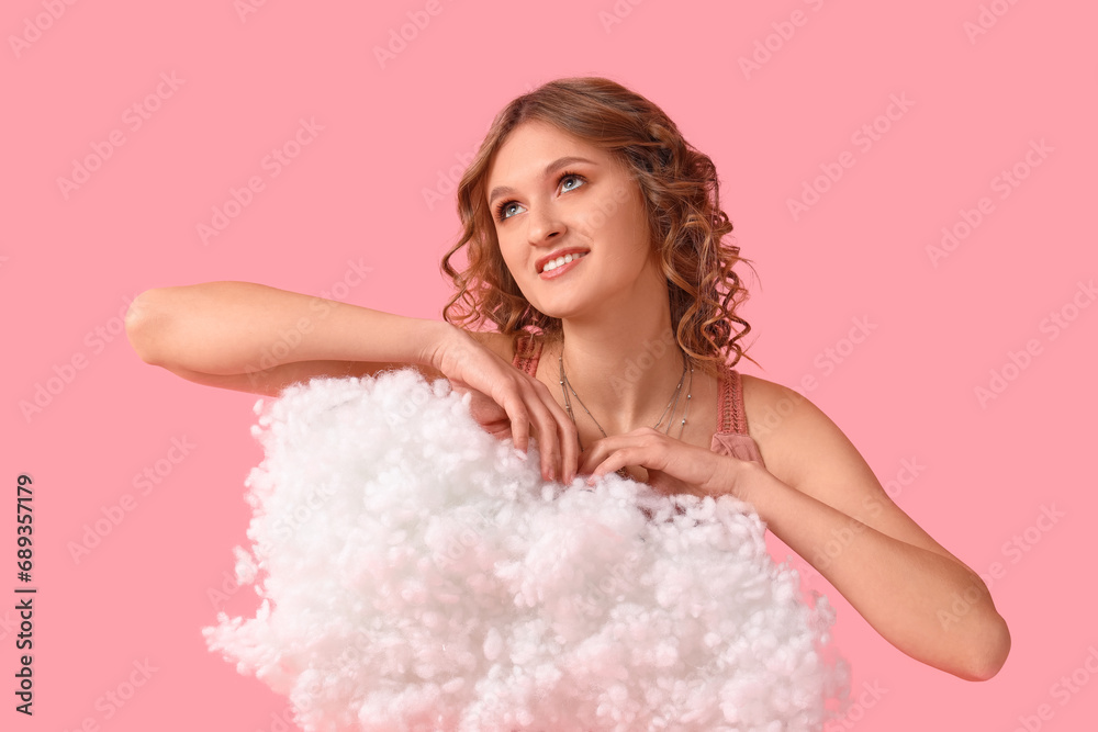 Young woman with white cloud on pink background Young woman with white cloud on pink background