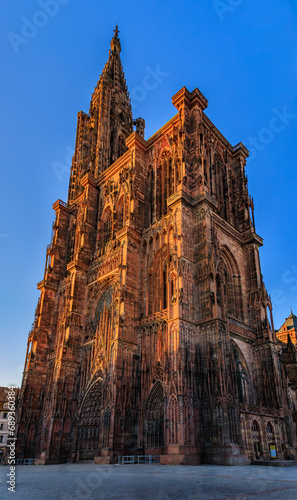 Ornate Gothic facade of the Notre Dame Cathedral in Strasbourg, Alsace, France, one of the most beautiful Gothic cathedrals in Europe at sunset