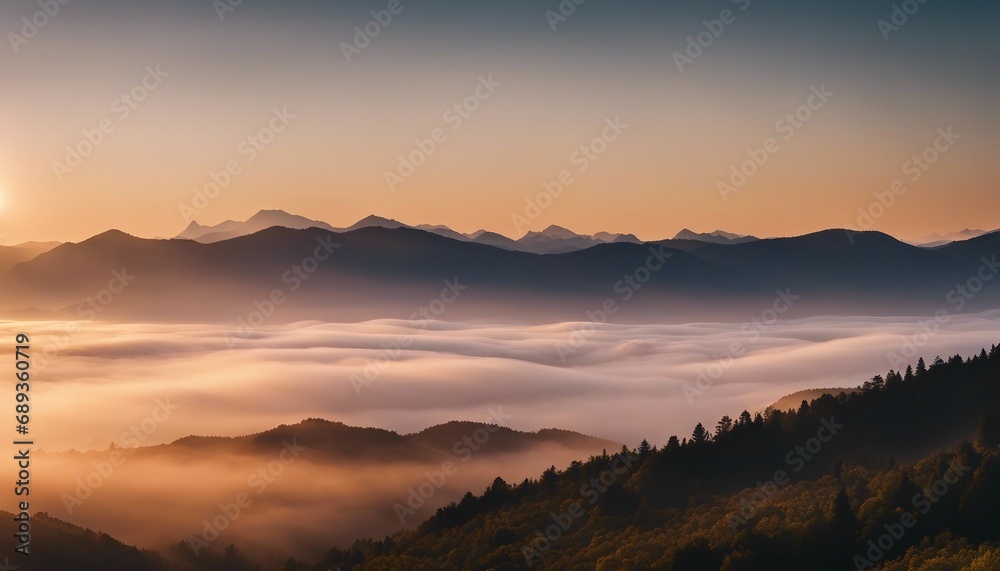 sunrise view over the foggy mountains
