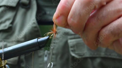 Angler making a fishing fly photo