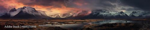 Snow-Capped Mountains, Reflective Waters, and Dramatic Orange Sky in a Darkened Landscape © Tigarto