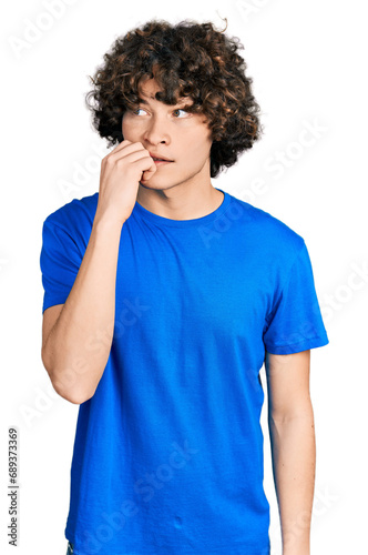 Caucasian teenager wearing casual clothes looking stressed and nervous with hands on mouth biting nails. anxiety problem.