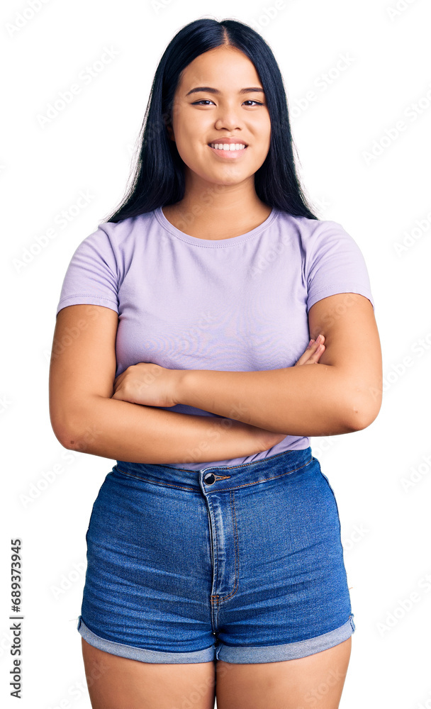 Fototapeta premium Young beautiful asian girl wearing casual clothes happy face smiling with crossed arms looking at the camera. positive person.