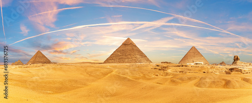 Picturesque panorama of the Pyramids and the Sphinx in the Giza desert near Cairo, Egypt photo