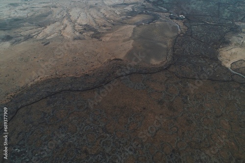 a view from an airplane with a dirt area in the foreground photo