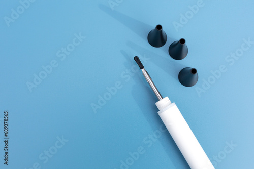 Mockup Digital Ear Scope, Nozzle For Wax Removal Tool. Otoscope, Earwax Cleaner With Gyroscope, Camera, Light. Cleaning Ears Device Connected to Smartphone. Ear Cleaning Technology. Horizontal photo