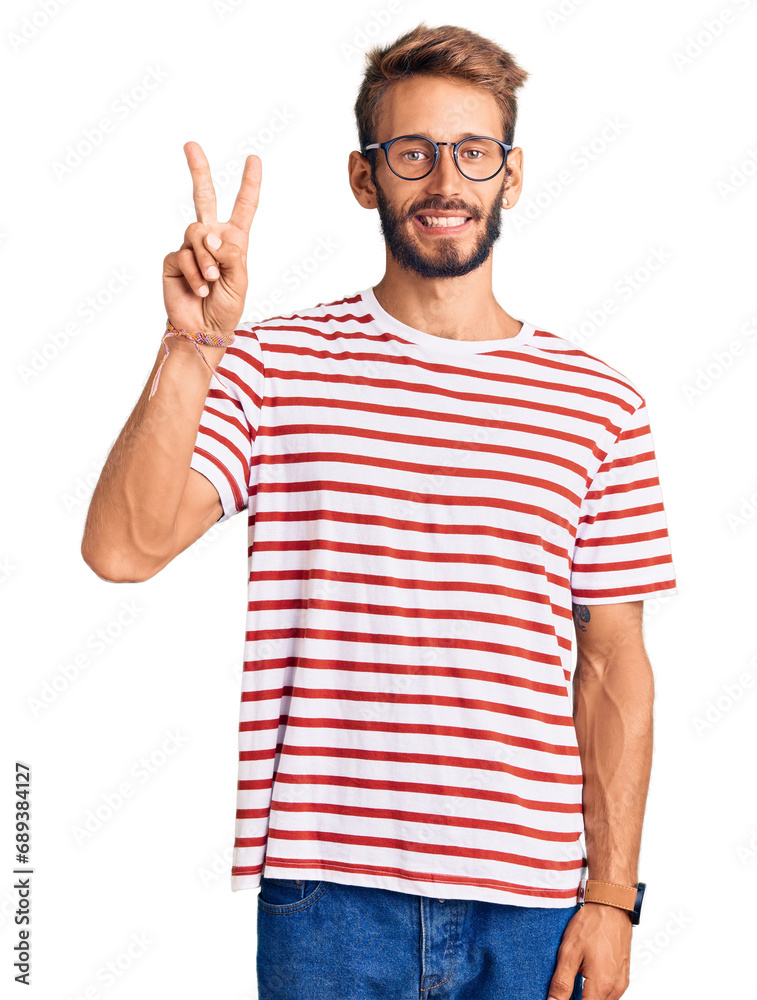 Handsome blond man with beard wearing casual clothes and glasses showing and pointing up with fingers number two while smiling confident and happy. Handsome blond man with beard wearing casual clothes and glasses showing and pointing up with fingers number two while smiling confident and happy.