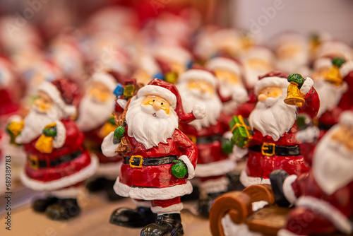 Many toy Santa Claus Christmas background. Happy New Year and Xmas theme.