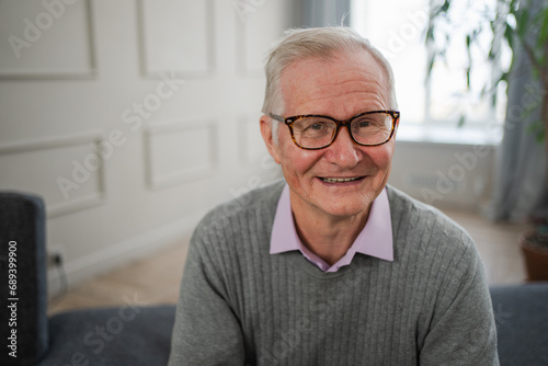 Portrait of confident stylish European middle aged senior man at home. Older mature 70s man smiling. Happy attractive senior grandfather looking camera close up face headshot portrait. Happy people © Юлия Завалишина