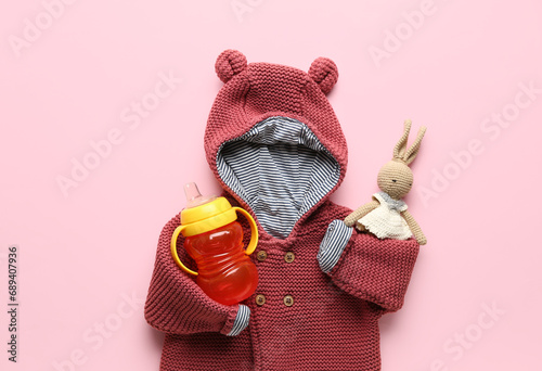 Knitted clothes with baby b...
