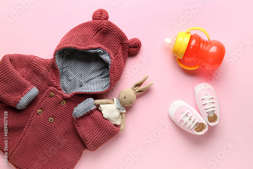 Knitted clothes with baby b...