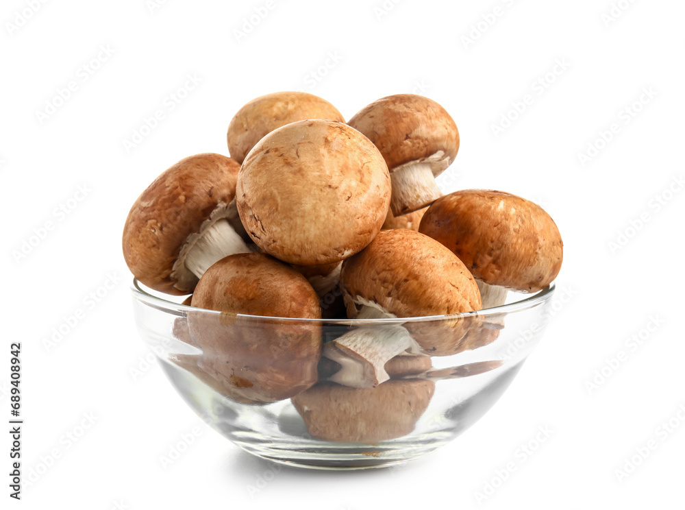 Glass bowl with set of raw champignon mushrooms on white background Glass bowl with set of raw champignon mushrooms on white background