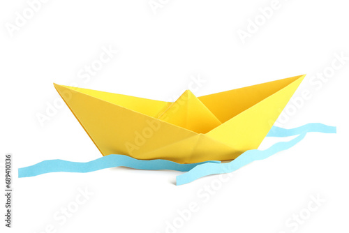 Yellow origami boat and waves on white background