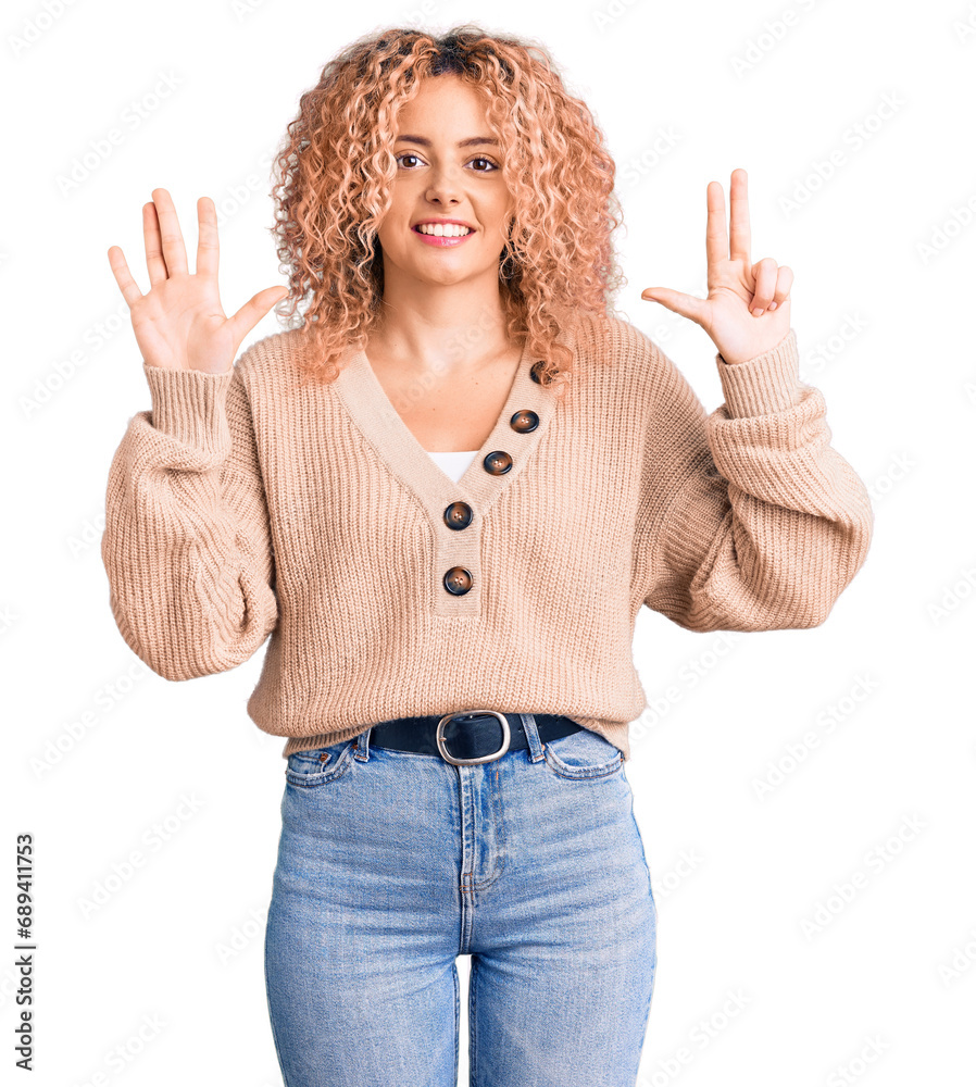 Young blonde woman with curly hair wearing casual winter jumper showing and pointing up with fingers number eight while smiling confident and happy. Young blonde woman with curly hair wearing casual winter jumper showing and pointing up with fingers number eight while smiling confident and happy.