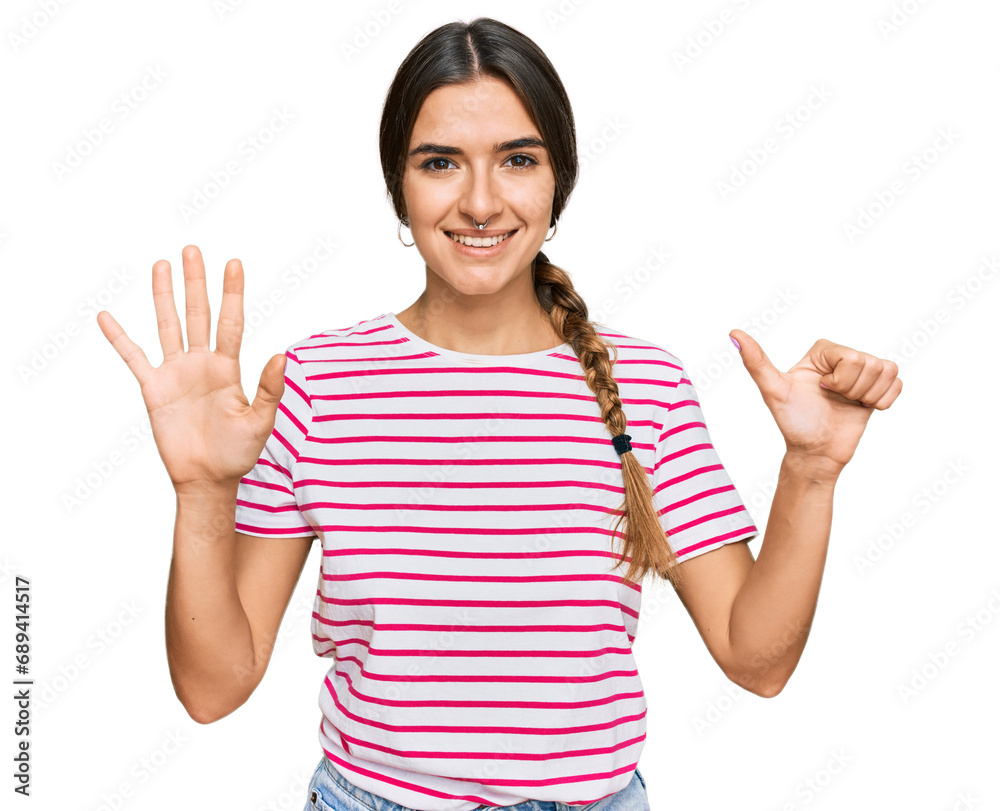 Young hispanic woman wearing casual clothes showing and pointing up with fingers number six while smiling confident and happy. Young hispanic woman wearing casual clothes showing and pointing up with fingers number six while smiling confident and happy.