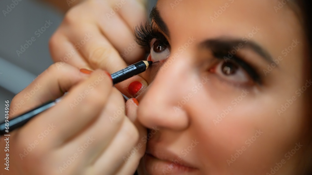 Preparing professional make-Up for the eyes - studio photography Preparing professional make-Up for the eyes - studio photography