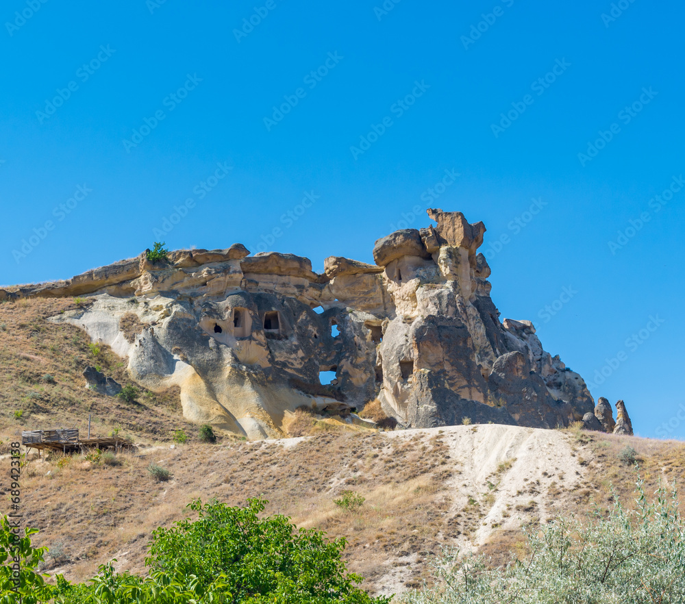 Fototapeta premium Rock Formation Dwellings in Pigeon Valley in Cappadocia, Turkey.