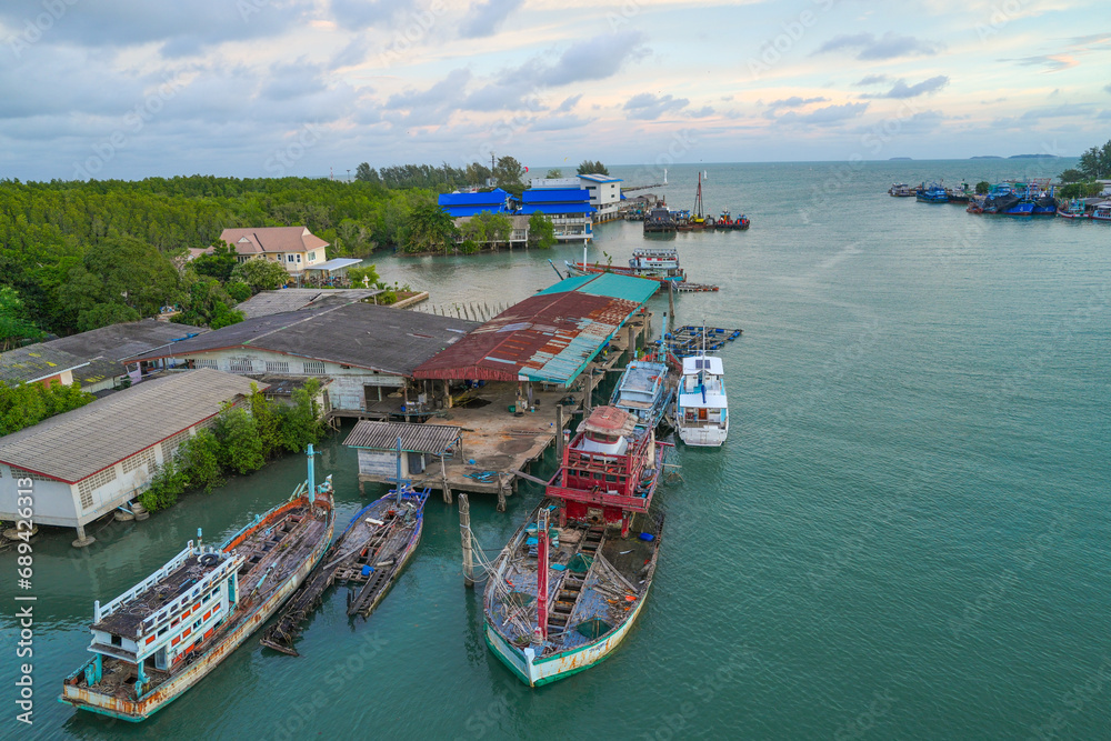 the panorama view landscape of Sea Gulf with a pier of boats. The village of sailors and fishing boats in Thailand.