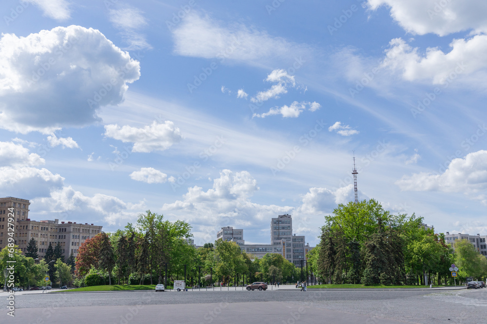 blue sky with clouds and silent svobody square in the center city of kharkiv