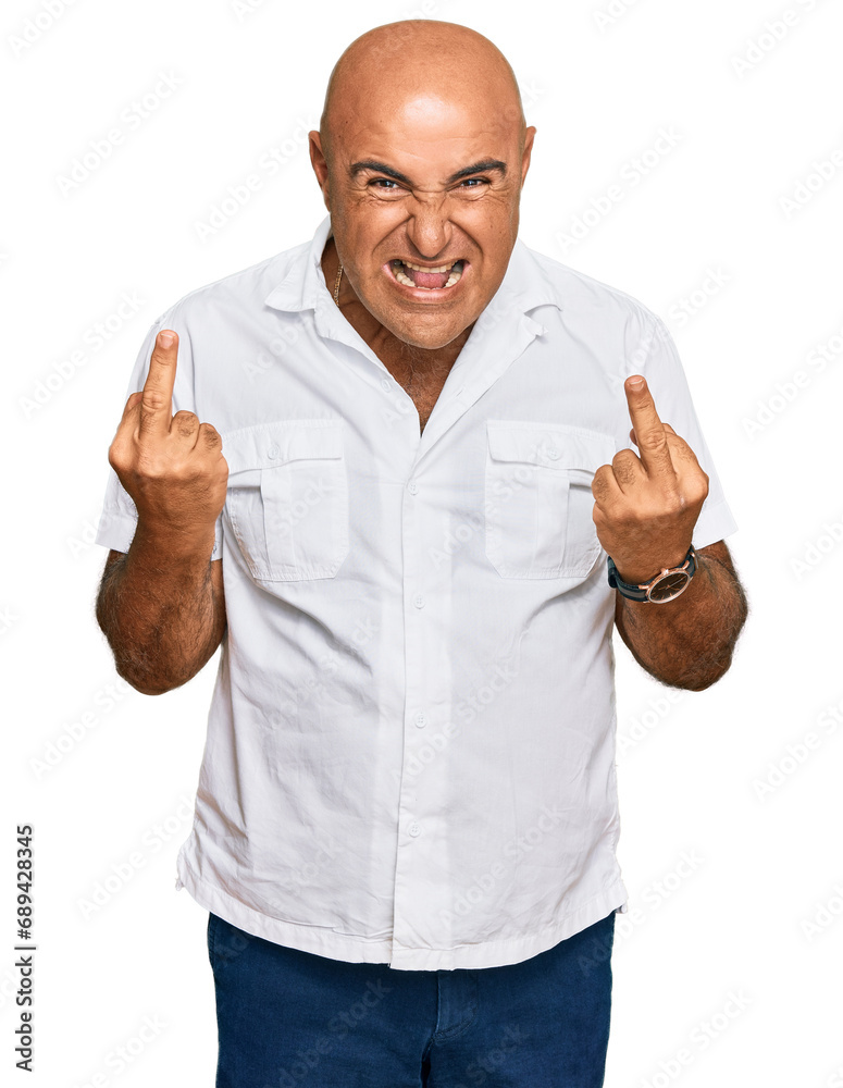 Mature middle east man with mustache wearing casual white shirt showing middle finger doing fuck you bad expression, provocation and rude attitude. screaming excited Mature middle east man with mustache wearing casual white shirt showing middle finger doing fuck you bad expression, provocation and rude attitude. screaming excited