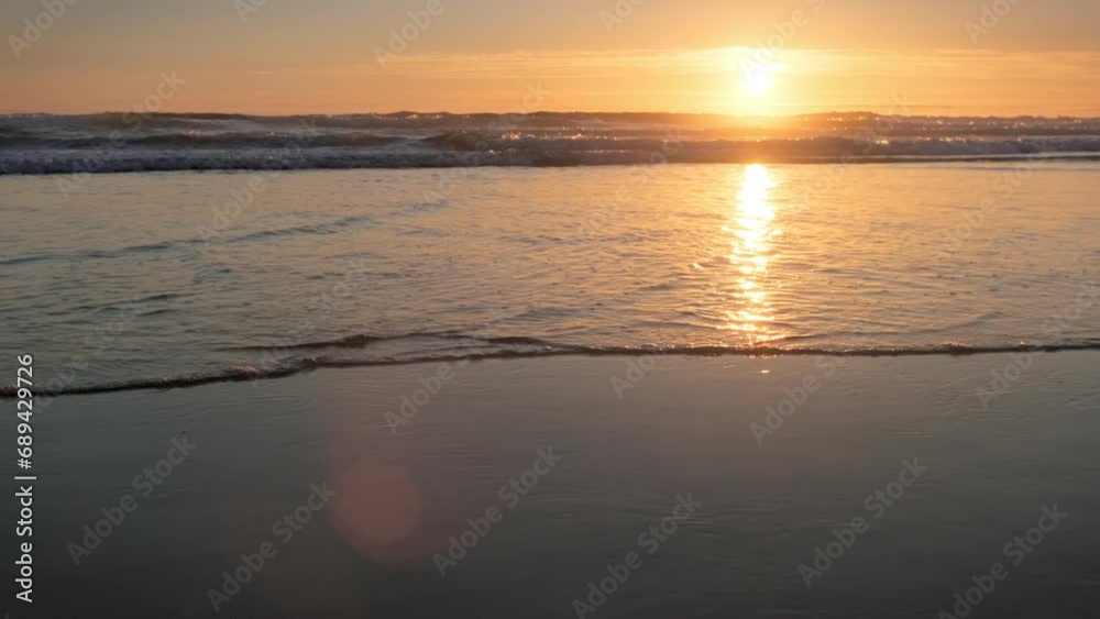 Atlantic ocean sunset with surging waves at Fonte da Telha beach, Costa da Caparica, Portugal Atlantic ocean sunset with surging waves at Fonte da Telha beach, Costa da Caparica, Portugal
