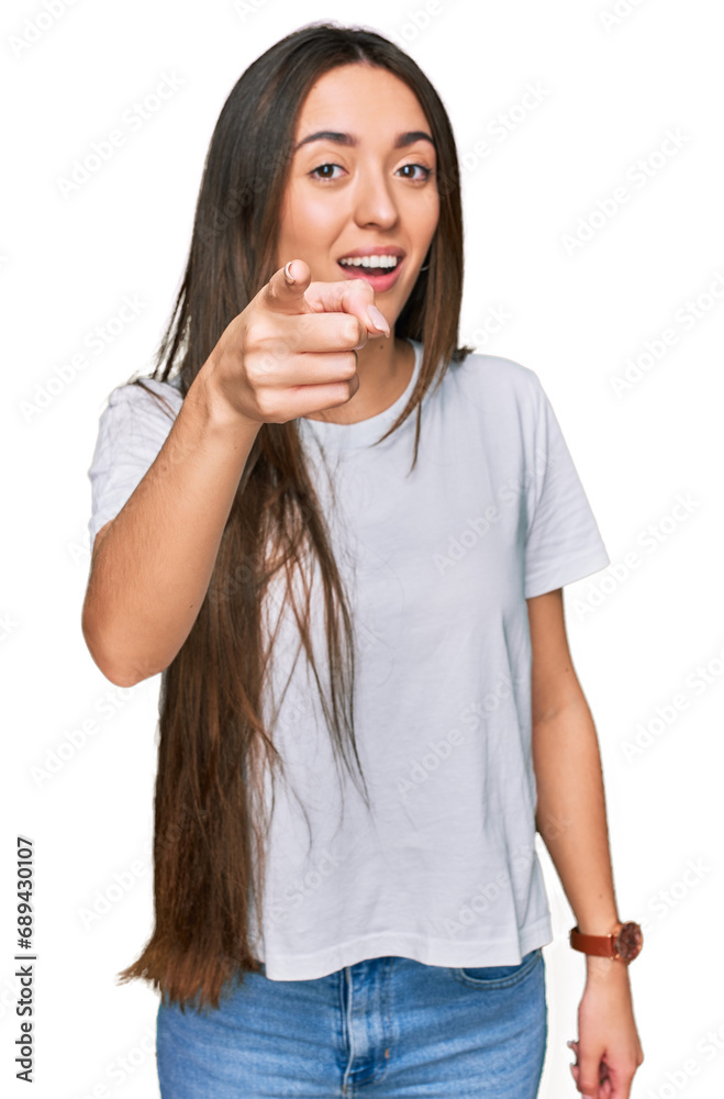 Young hispanic girl wearing casual white t shirt pointing displeased and frustrated to the camera, angry and furious with you Young hispanic girl wearing casual white t shirt pointing displeased and frustrated to the camera, angry and furious with you