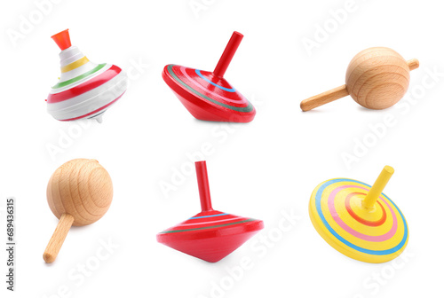 Foto Different spinning tops isolated on white. Toy whirligig