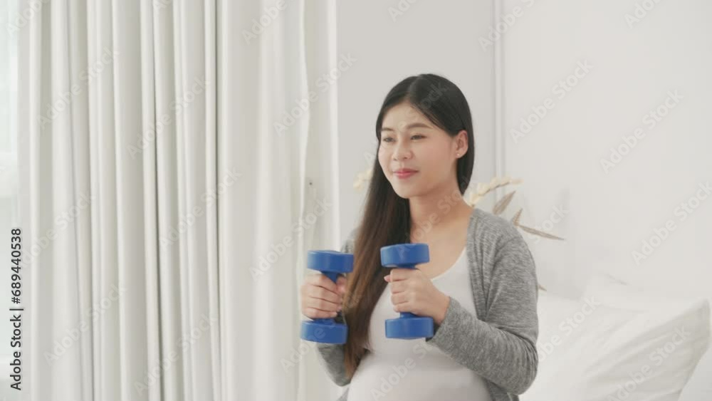beautiful pregnant woman, sitting on bed in bedroom, preparing to give a birth beautiful pregnant woman, sitting on bed in bedroom, preparing to give a birth