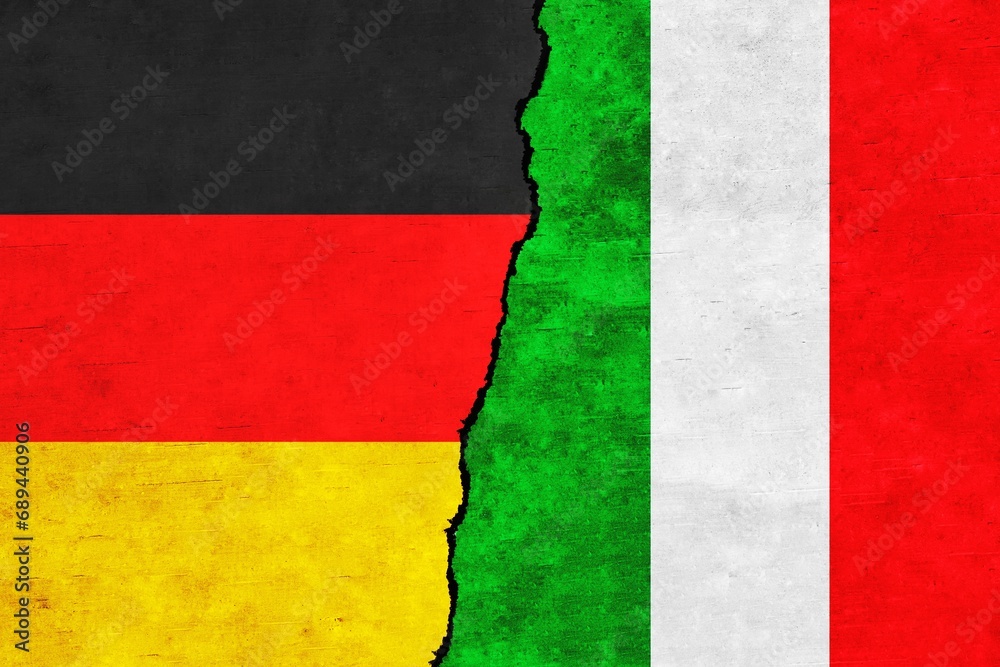 Germany and Italy painted flags on a wall with a crack. Italy and Germany relations.Germany and Italy flags together