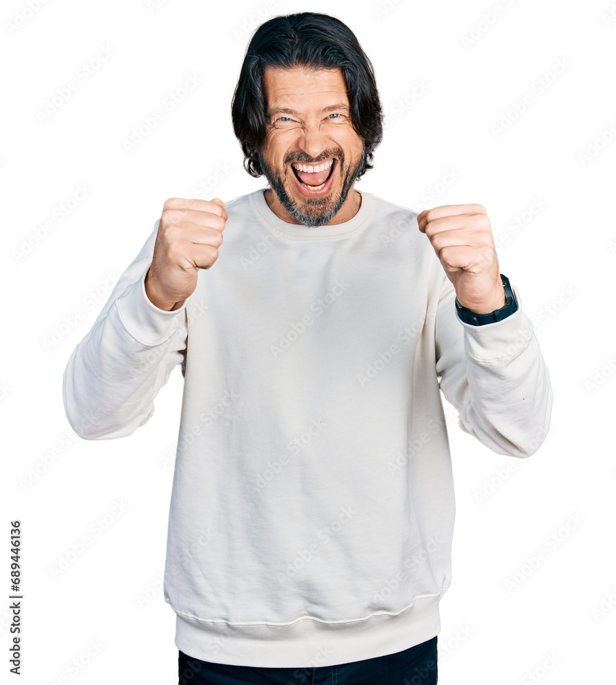 Middle age caucasian man wearing casual clothes angry and mad raising fists frustrated and furious while shouting with anger. rage and aggressive concept. Middle age caucasian man wearing casual clothes angry and mad raising fists frustrated and furious while shouting with anger. rage and aggressive concept.