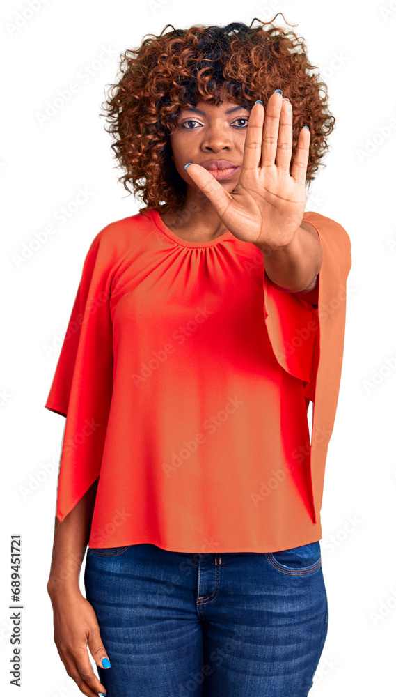 Young african american woman wearing casual clothes doing stop sing with palm of the hand. warning expression with negative and serious gesture on the face. Young african american woman wearing casual clothes doing stop sing with palm of the hand. warning expression with negative and serious gesture on the face.