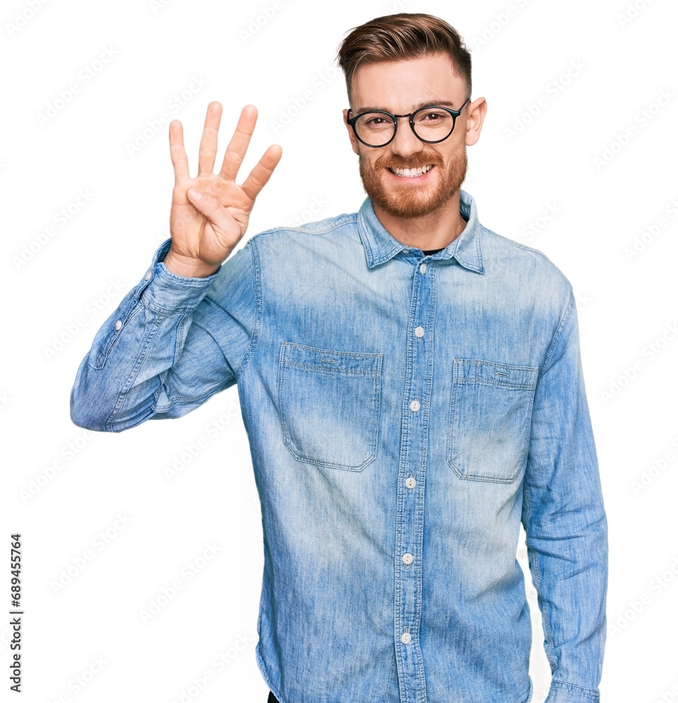 Young redhead man wearing casual denim shirt showing and pointing up with fingers number four while smiling confident and happy. Young redhead man wearing casual denim shirt showing and pointing up with fingers number four while smiling confident and happy.