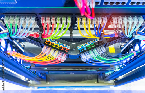 Network panel, switch and colorful cable in data center