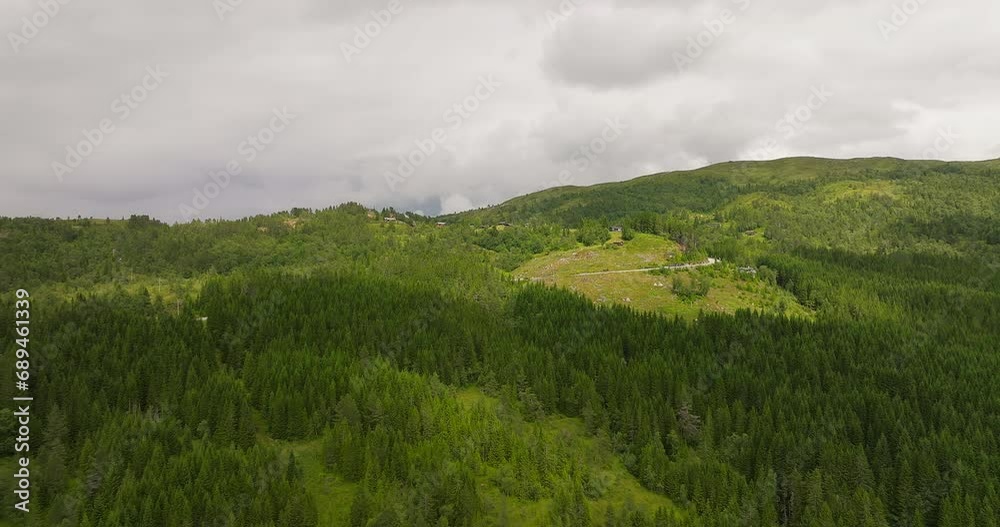 Woodland On Slope Mountains And Road On The West Coast Of Norway. Aerial Drone Shot Woodland On Slope Mountains And Road On The West Coast Of Norway. Aerial Drone Shot