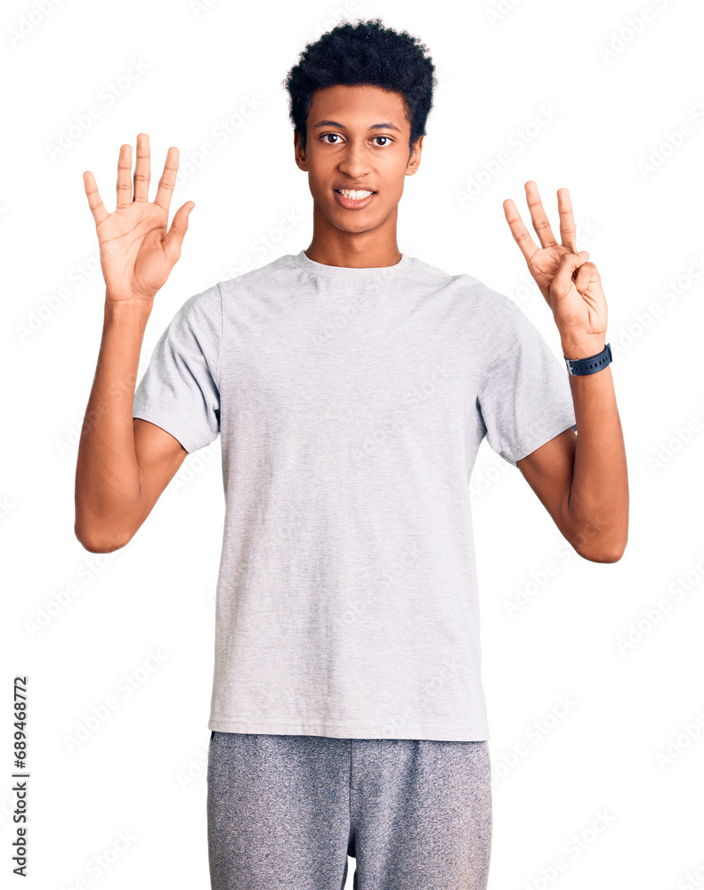 Young african american man wearing casual clothes showing and pointing up with fingers number eight while smiling confident and happy. Young african american man wearing casual clothes showing and pointing up with fingers number eight while smiling confident and happy.