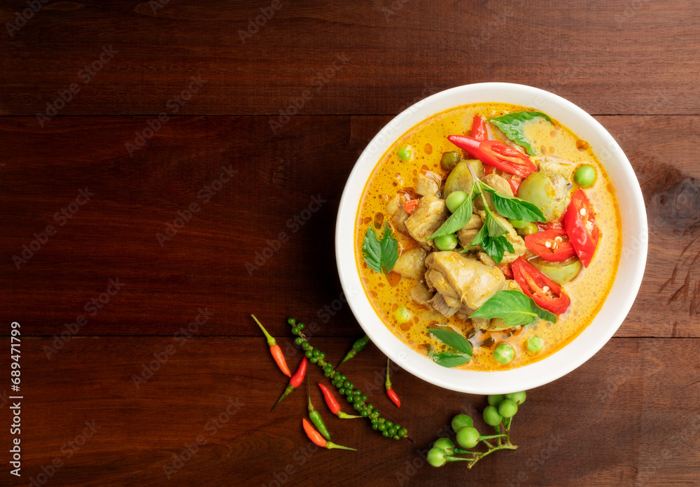 Chicken green curry Asian food, Beef green curry Thai food on a soup bowl with a mixture of herbs, vegetables and Thai red chilli spices. Top view. Chicken green curry Asian food, Beef green curry Thai food on a soup bowl with a mixture of herbs, vegetables and Thai red chilli spices. Top view.