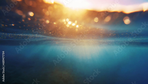 Vivid abstract underwater scene: sunlight piercing through ocean depths, creating a mesmerizing, defocused backdrop photo